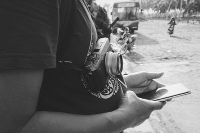 Close-up of woman holding mobile phone