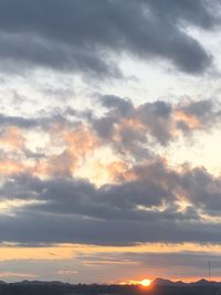 Low angle view of cloudy sky during sunset