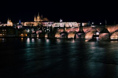 Illuminated city at waterfront