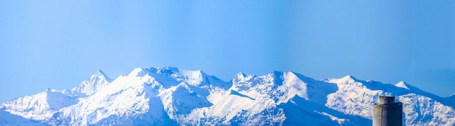 Scenic view of snow covered mountains