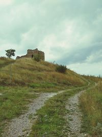 Built structure on land against sky