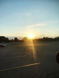 Airplane against sky during sunset