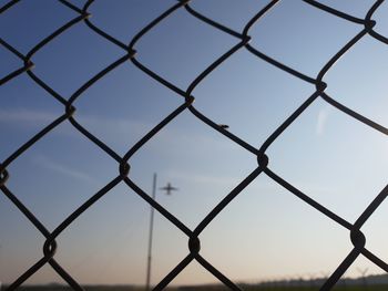 Full frame shot of chainlink fence against clear sky