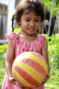 Portrait of cute girl with balloons