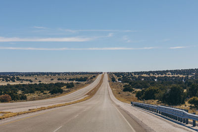 Road amidst landscape against sky