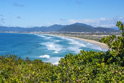 Scenic view of sea against blue sky