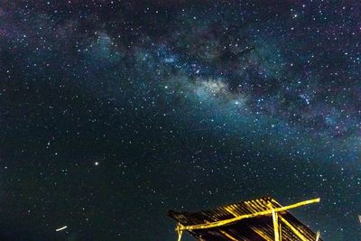Low angle view of fireworks against sky at night