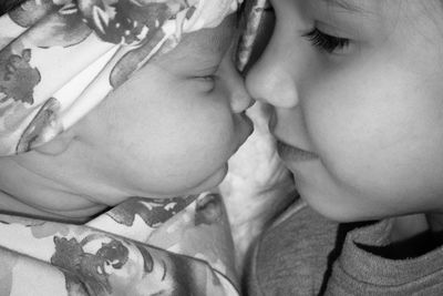 Close-up of girl with sister