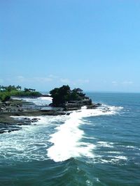 Scenic view of sea against clear blue sky