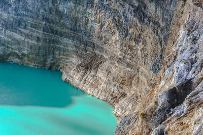 High angle view of rock formation in sea