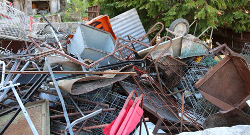 Many old rusty irons piled in a landfill