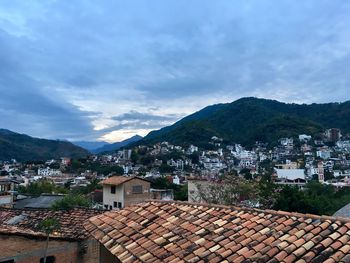 Houses against sky in city