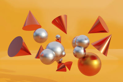 Close-up of balloons against orange background