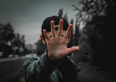 Close-up of human hand against blurred background