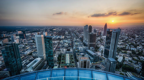 Aerial view of cityscape during sunset