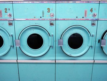 Close-up of clothes drying against blue background