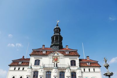 Low angle view of building against blue sky