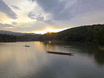 Scenic view of lake against sky during sunset
