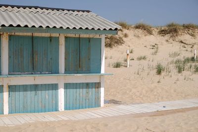 Built structure on beach against sky