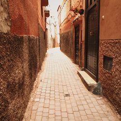 Narrow alley amidst buildings in city