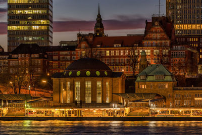 Illuminated buildings at waterfront