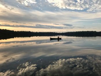 Scenic view of lake against sky during sunset