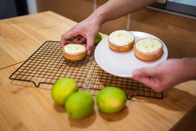 High angle view of person preparing food on table