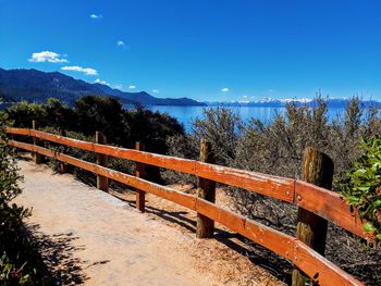 Scenic view of mountains against blue sky