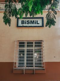 Low angle view of text on building wall