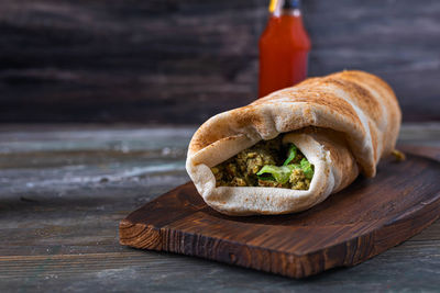 Close-up of bread on wooden table