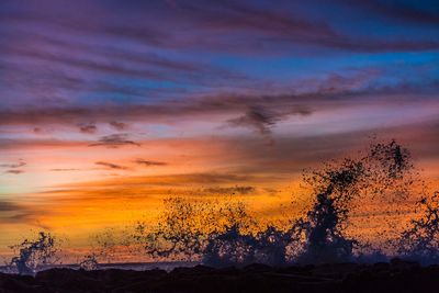 Scenic view of dramatic sky during sunset