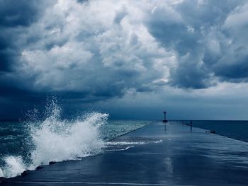 Scenic view of sea against cloudy sky