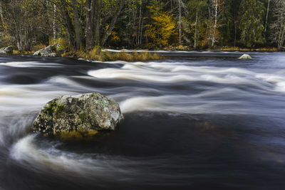 Rock in river, gysinge, sweden