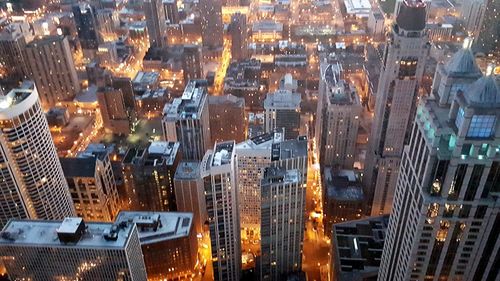 Aerial view of illuminated cityscape at night