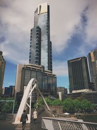 Low angle view of building against cloudy sky