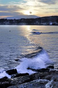 Scenic view of sea against sky during sunset