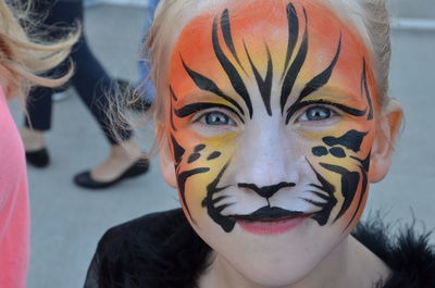 Close-up portrait of girl with face paint