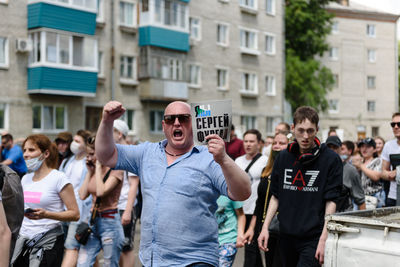 Group of people in front of buildings