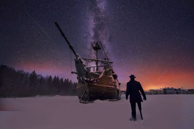 Ship on frozen sea with sailor