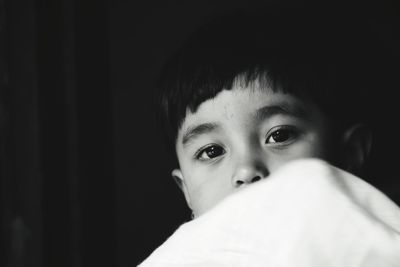 Close-up portrait of cute girl at home