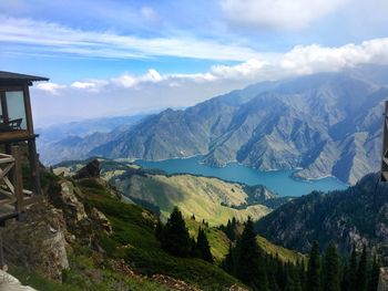 Scenic view of mountains against cloudy sky