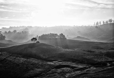 Scenic view of landscape against cloudy sky