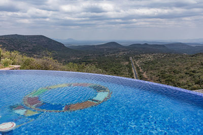 Scenic view of swimming pool against sky