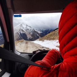 Tourists on snow covered mountain