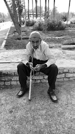 Portrait of man sitting on chair