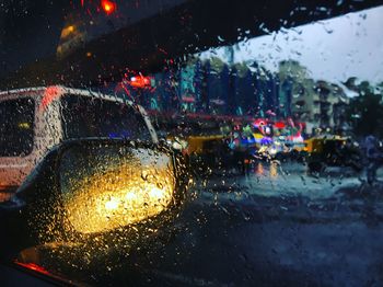 Water drops on car window during rainy season