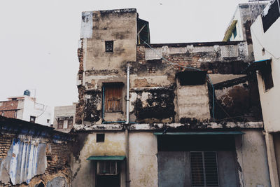 Low angle view of old buildings against sky