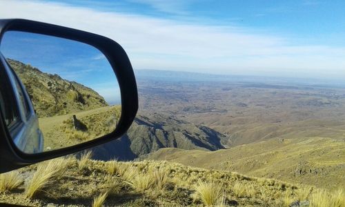 Scenic view of landscape seen through car windshield