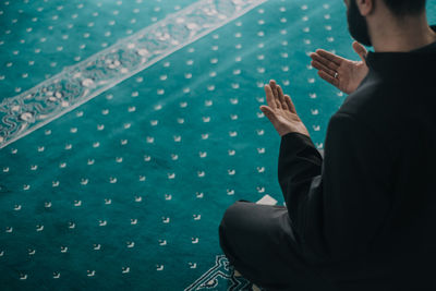 High angle view man praying in mosque