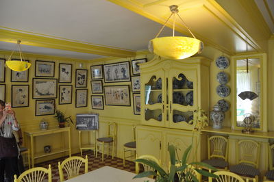 Illuminated lamps hanging on ceiling at home